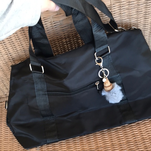 im not sure Handbags - Black Women's Travel Duffel Bag with Pom Keychain